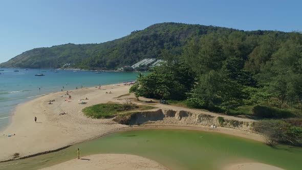 Aerial view drone camera of Beautiful tropical sea sandy beach and waves crashing against sand beach