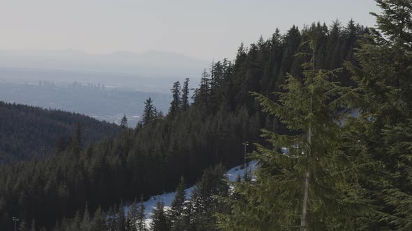 View of Top of Grouse Mountain Ski Resort with the City in the Background