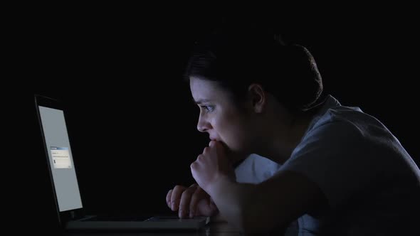 Nervous Woman Waiting for Files Downloading or Upgrading of Software on Laptop