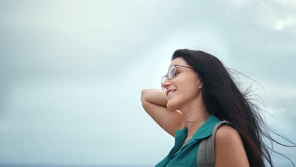 Smiling Travel Woman Relaxing Enjoying Summer Vacation at Sky Background