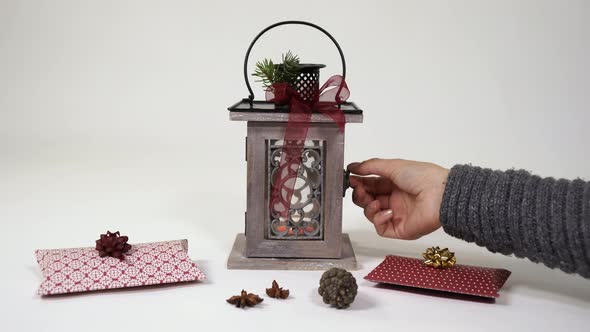 Blowing out the candle inside a lantern