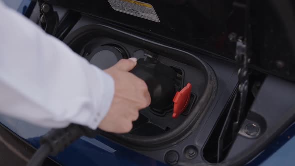 View of a Charger of an Blue Electric Car