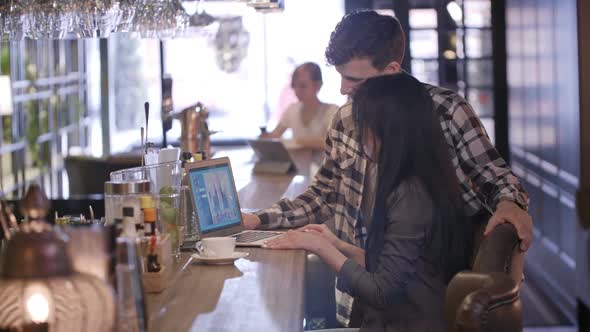 Business Partners Talking on Video Call at Bar