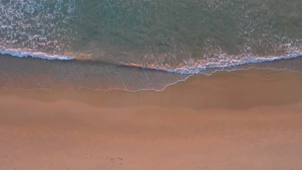 Aerial Top View A Lady Lay Down On The Beach.