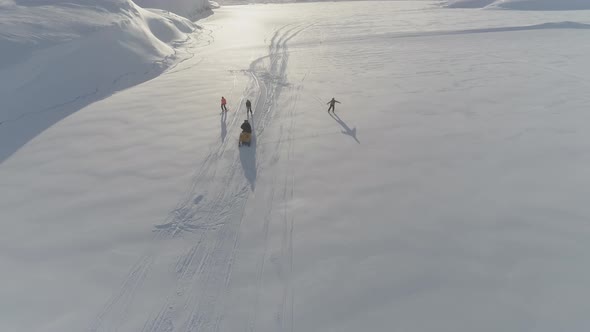 Ski-doo Pull Skiing on Snow Surface Aerial View