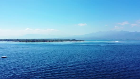 Aerial drone shot sky of paradise shore beach trip by blue lagoon with white sand background of jour