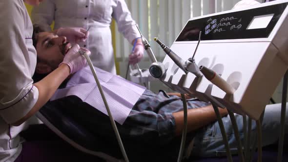 Dentist Using Drill To Cure Caries From Tooth