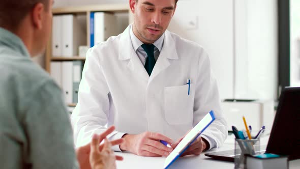 Doctor Showing Cardiogram To Patient at Hospital 25