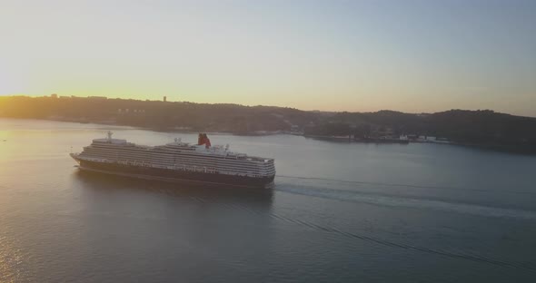 Flying Over A ship On The Tagus River With The Lisbon Skyline On The Background. huge reflexion at s