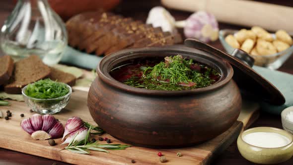 Boiled Borsch with Dill and Parsley Closeup Cooking Soup Made of Beetroot