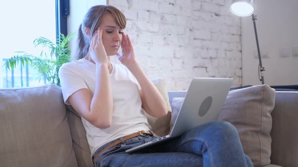 Tired Woman Sitting with Headache Pain