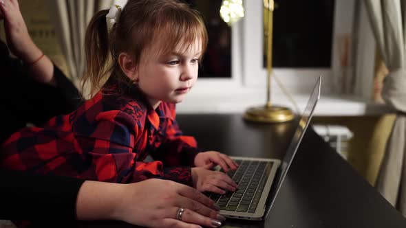 the Little Daughter Prevents the Freelancer Mother From Working on the Computer