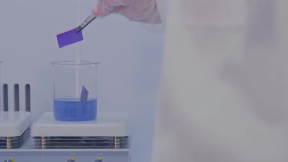 A Researcher Working In A Chemical Lab