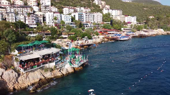Beach on the Cliffs in the Kas City Center and People Swimming 4K