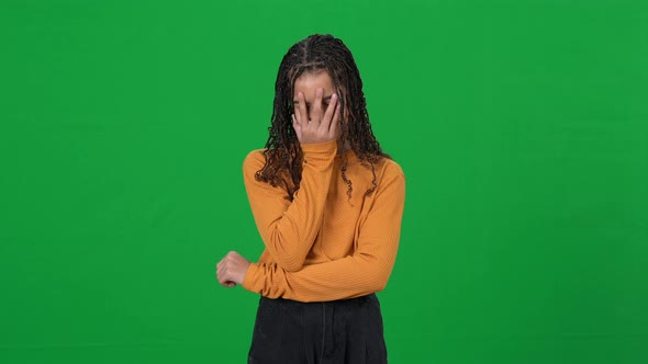 Portrait of Annoyed African American Teen Girl Making Facepalm Gesture and Looking at Camera on