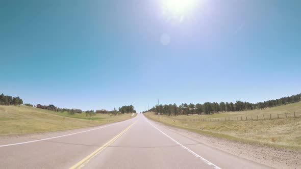 POV point of view - Driving through countryside in Eastern Colorado.