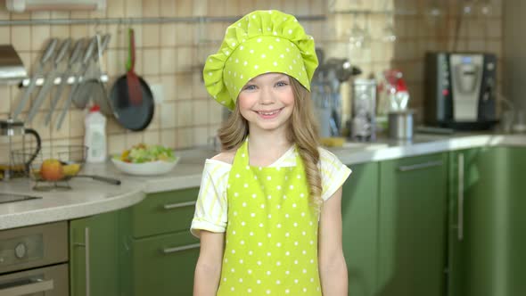 Happy Girl with Kitchen Utensils.