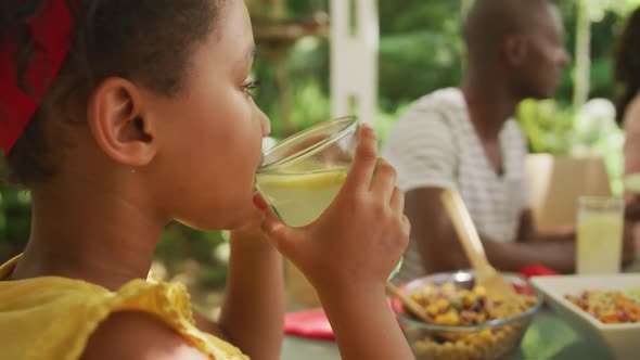 Close up of an African American girl spending time in garden