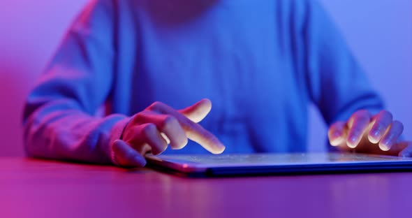 Woman use of tablet computer at home