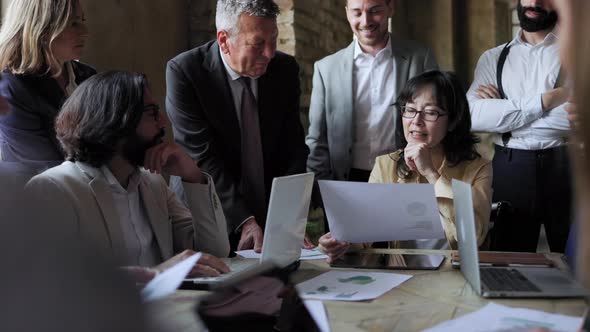 Multiracial business group of people working together at conference meeting inside office