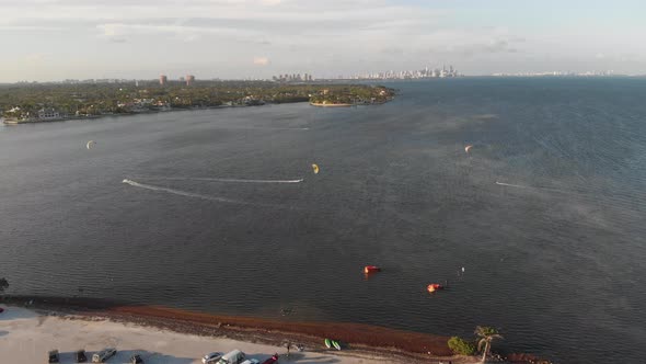 Aerial View of Ocean with Skyline and Paragliders