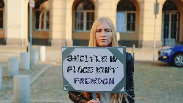 Woman Protesting That Shelter in Place Does Not Mean Freedom