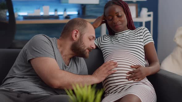 Married Interracial Couple Expecting Child Bonding at Home