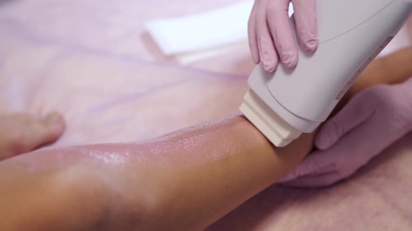 Closeup of Hair Removal Machine Used By Cosmetologist in Salon