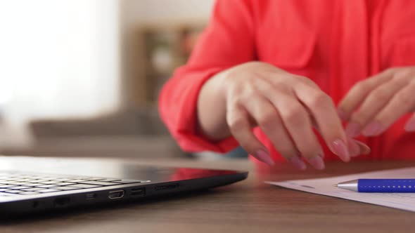 Woman with Laptop Working at Home Office