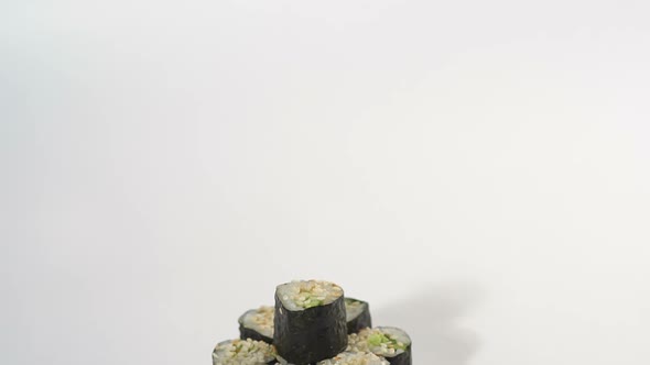 Maki Roll with Cucumber and Sesame Seeds on White