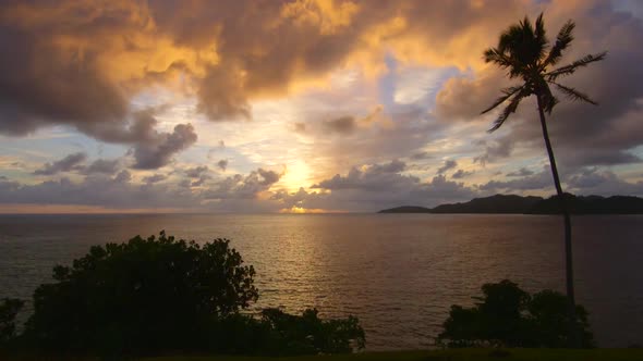 View of a scenic tropical island in Fiji at sunset.