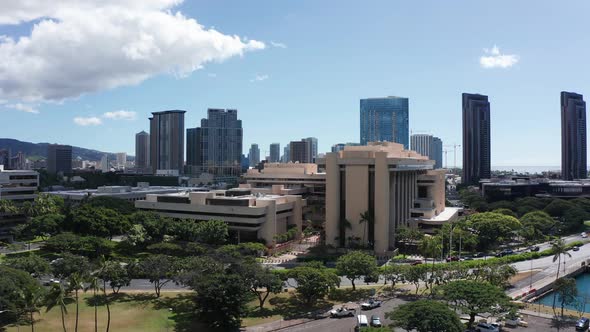 Rising push-in aerial shot of downtown Honolulu, Hawaii. 4K