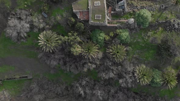 Aerial top-down rising over old hut in Serra de Dentro on Porto Santo Island. Madeira.