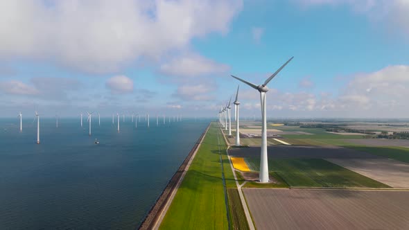 Offshore Windmill Park with Clouds and a Blue Sky Windmill Park in the Ocean Drone Aerial View with