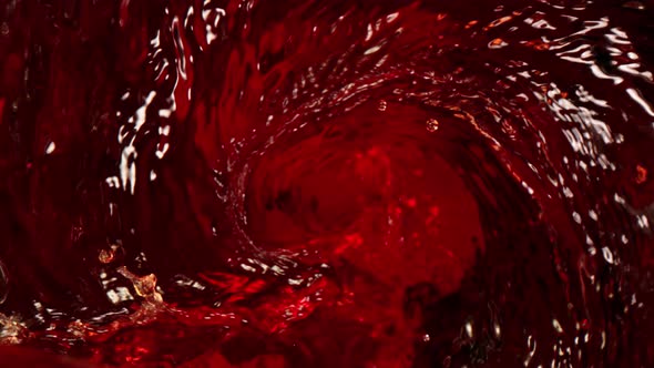 Super Slow Motion Shot of Pouring Red Wine Into Whirl at 1000 Fps