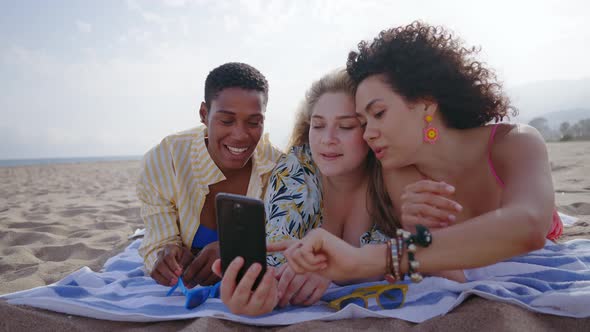 young women having fun on the beach