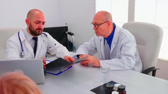 Doctors Coworkers Analysing Radiography of Patient