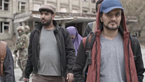 Arab Refugees Walking in Camp