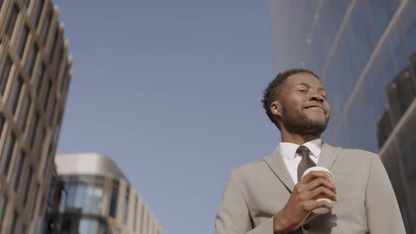 Portrait of African Man Drinking Coffee in Downtown