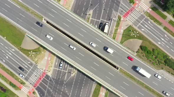 Summer aerial footage of transport junction, traffic cross road junction day view from above with hi