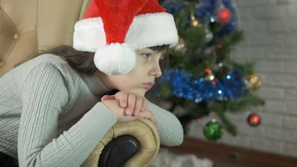 Sad Child Wait for Santa in Living Room