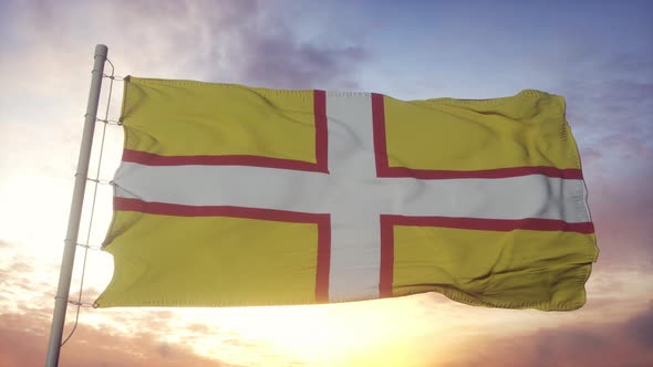 Dorset flag, England, waving in the wind, sky and sun background