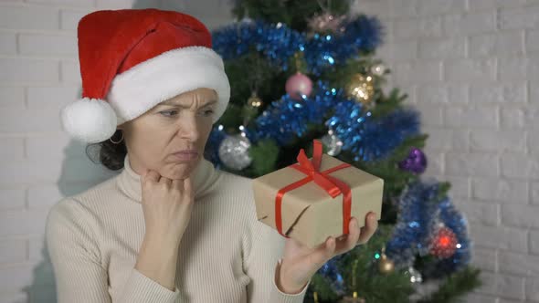 Stressed Woman with Unpleasant Gift