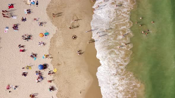 Aerial View From Flying Drone Of People Crowd Relaxing On Beach In Bulgaria