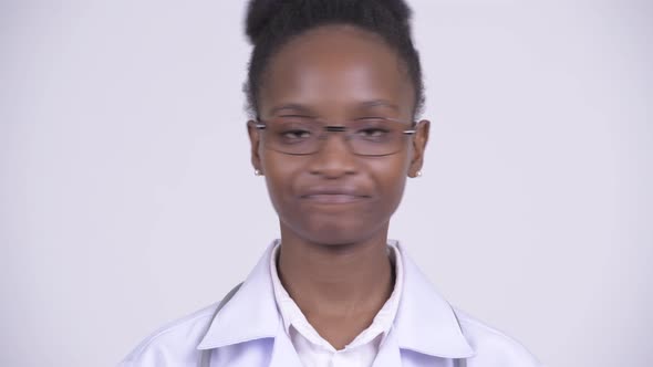 Face of Young African Woman Doctor Nodding Head No