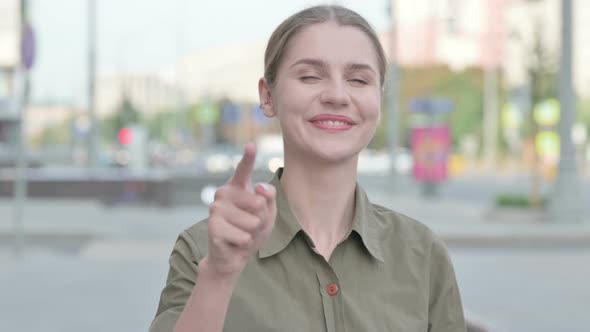 Woman Pointing at the Camera Outdoor