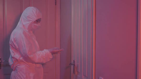 Young Female Laboratory Worker Coming Into Room with Red Lighting, Closing Door By Key, and Leaving