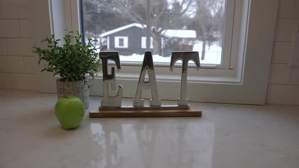 An eat sign on a kitchen counter.