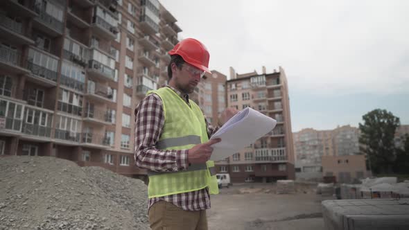 An Innovative Supervisor in Construction in Helmet and Wearer Checks Materials and Checks Quantity