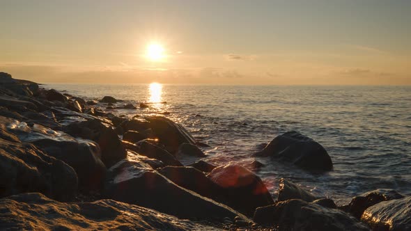 Romantic colorful sunset at the sea. Against the background of the sea, the sun goes down